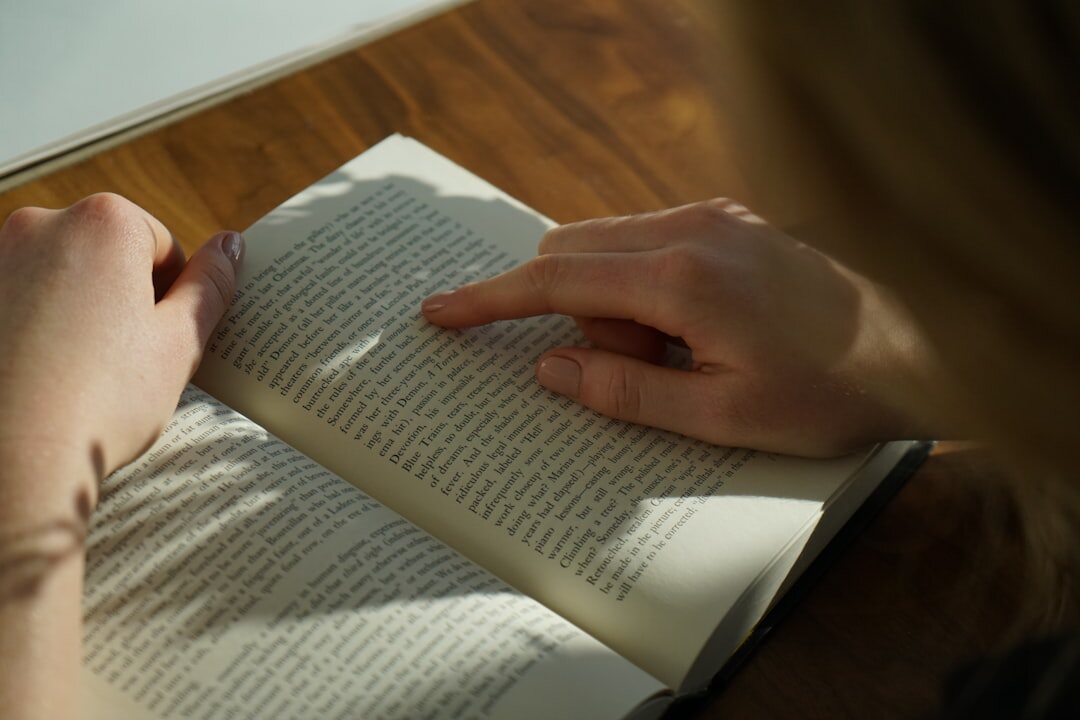 person reading self help book