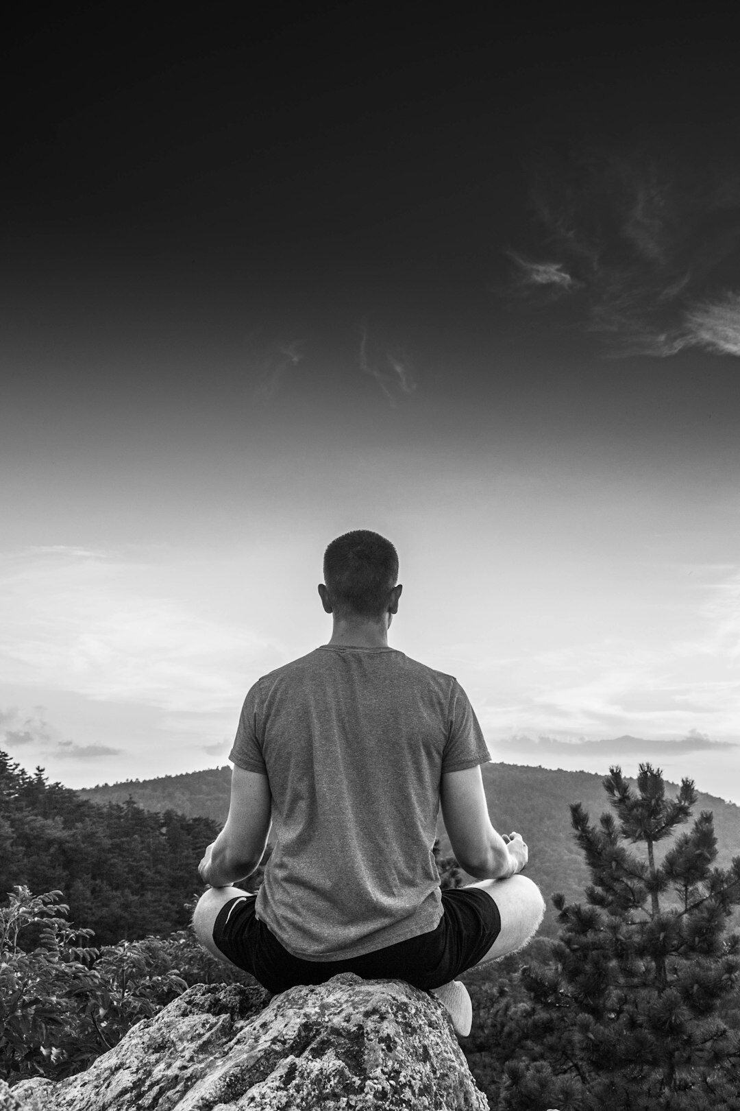 person meditating in nature