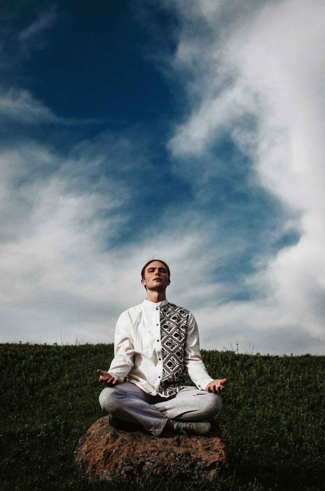 person meditating in nature